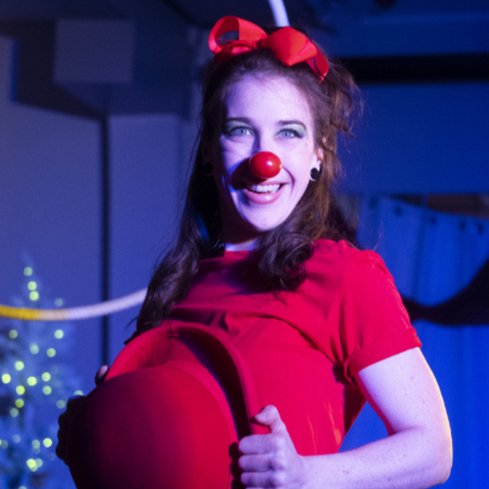 Susan dressed as a clown and smiling at the camera