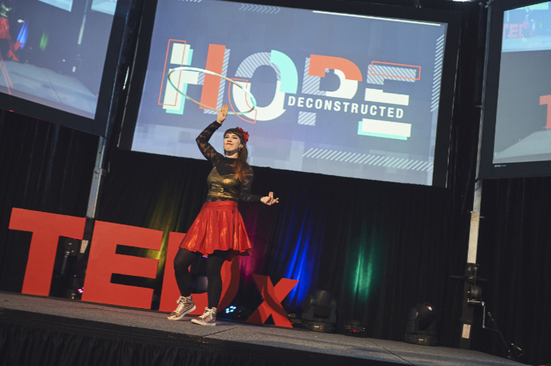 Susan hula hooping at a TEDx conference